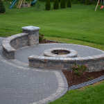 Rounded Stone Brick Patio with Fire Pit