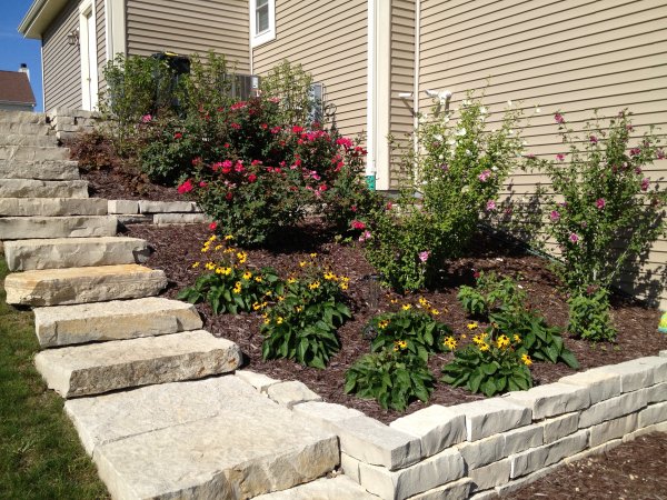 Terraced stone retaining wall with stairs contractor for Ozaukee County