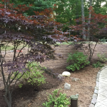 Brick retaining wall for walkway edging builder in Ozaukee County