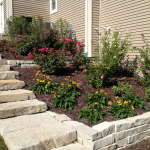 Terraced stone retaining wall with stairs contractor for Ozaukee County