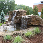 backyard and commercial lot waterfall design & installation in Ozaukee County